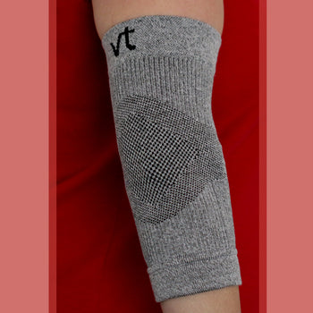Grey Elbow Compression Sleeve on Red Background
